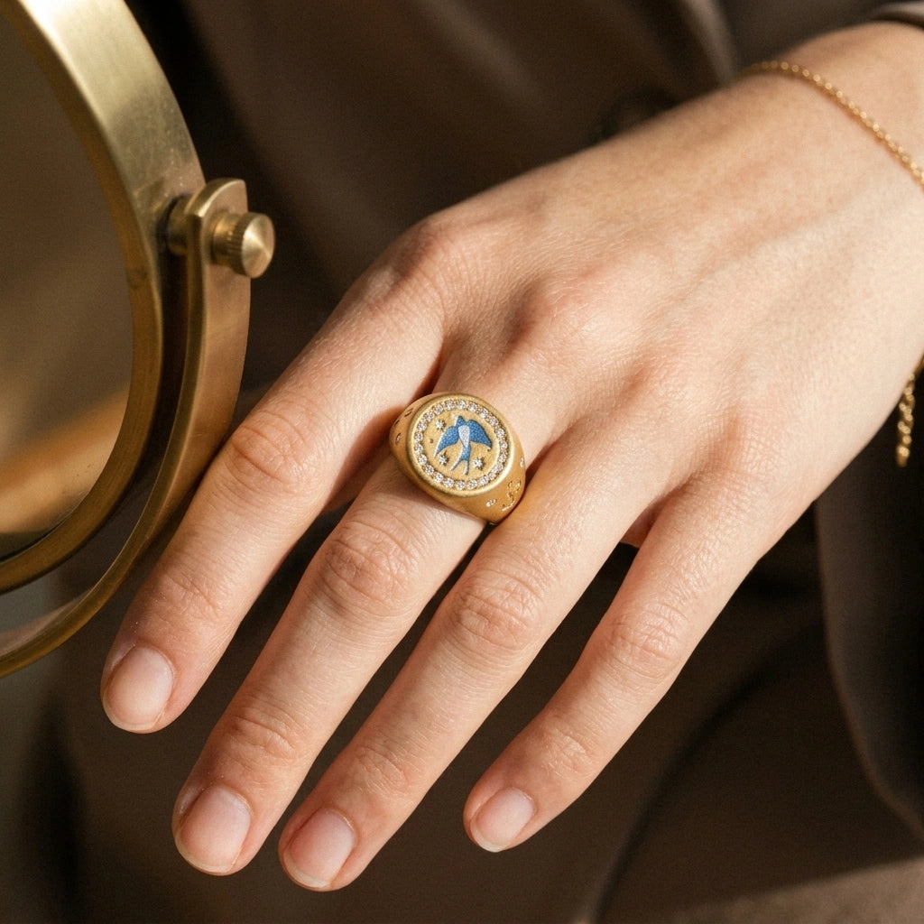 Homeward Swallow Ring worn on the hand, close-up