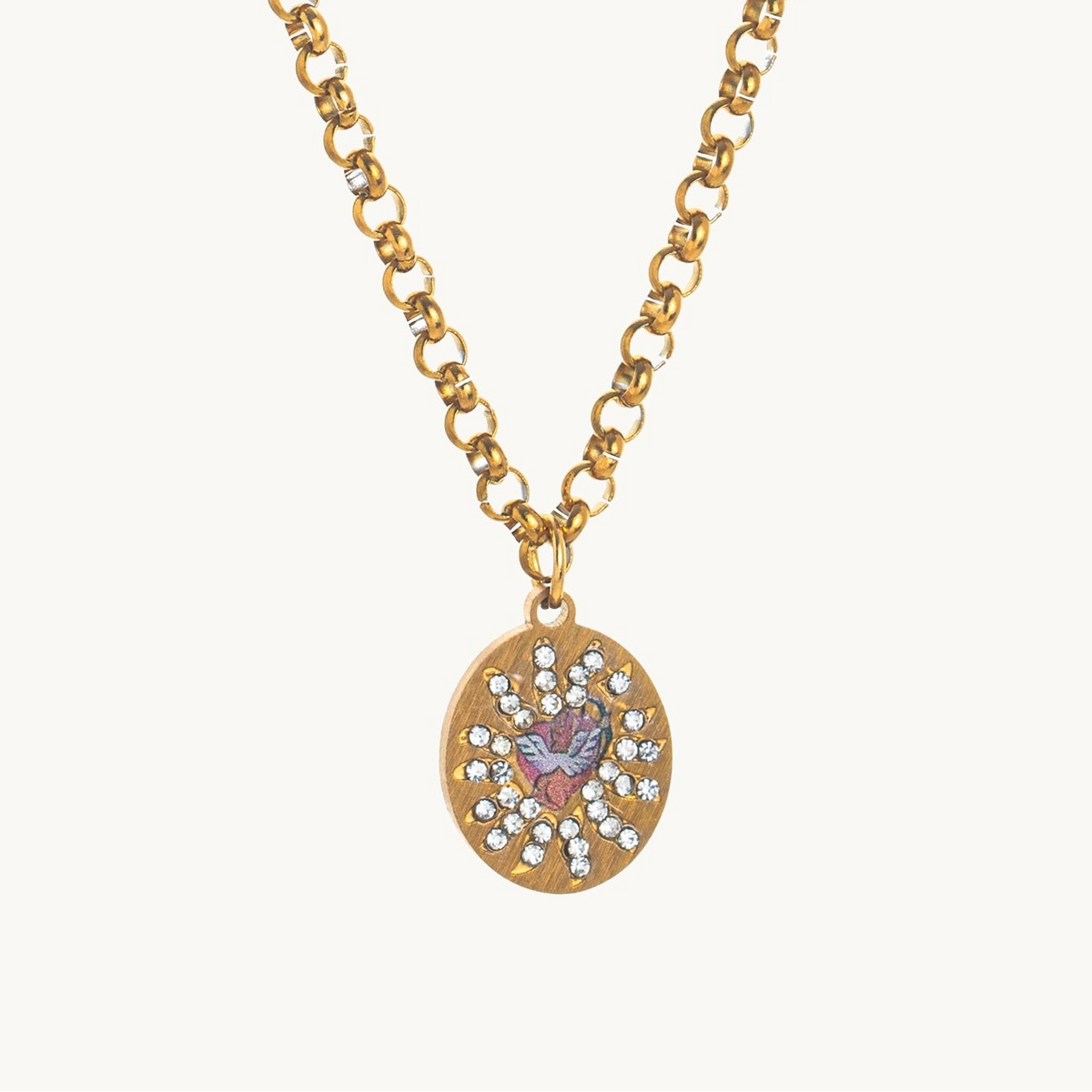 Cherub's Arrow Necklace, an oval gold-tone pendant with a winged enamel cherub