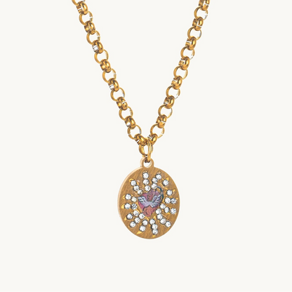 Cherub's Arrow Necklace, an oval gold-tone pendant with a winged enamel cherub