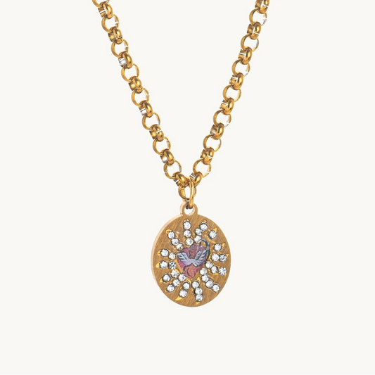 Cherub's Arrow Necklace, an oval gold-tone pendant with a winged enamel cherub