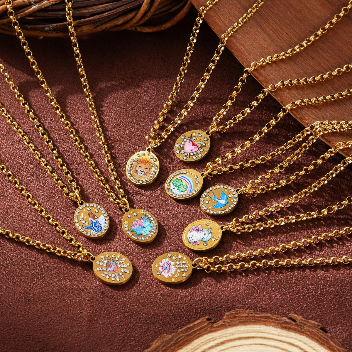 Pendant necklaces fanned out on brown fabric