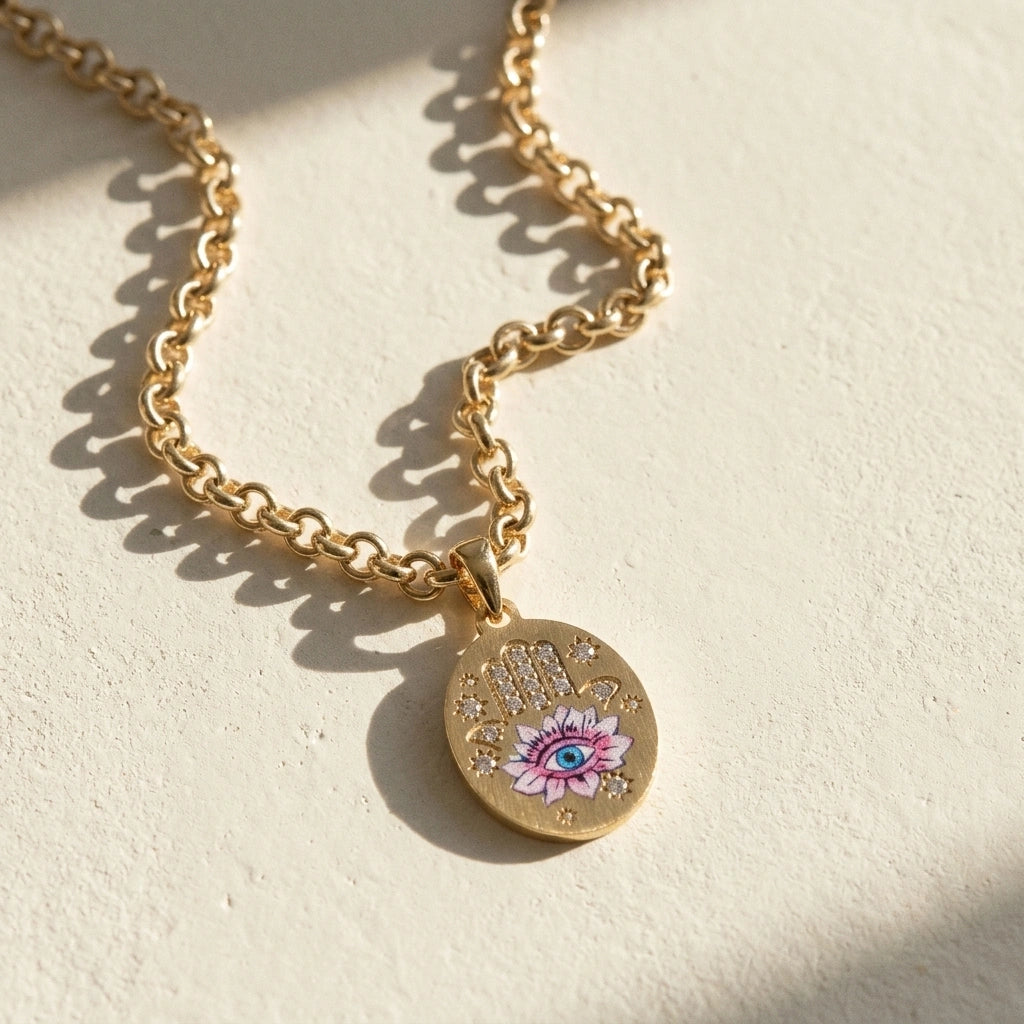 Hamsa Eye Necklace pendant on cream fabric