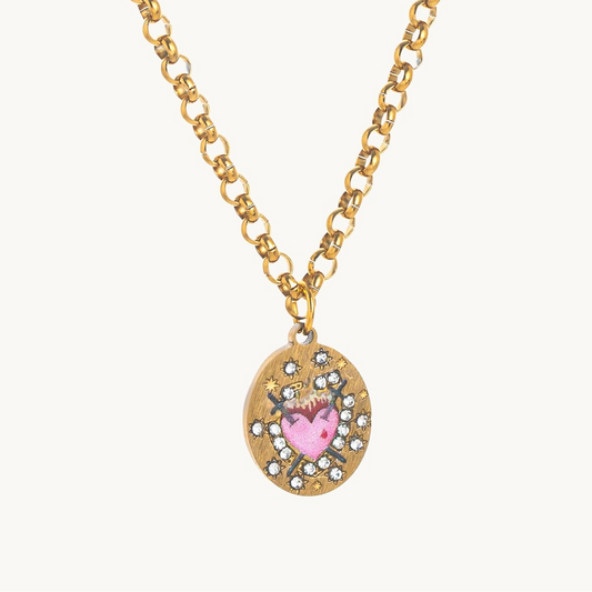 Sacred Heart Necklace, an oval gold-tone pendant with a flaming enamel sacred heart
