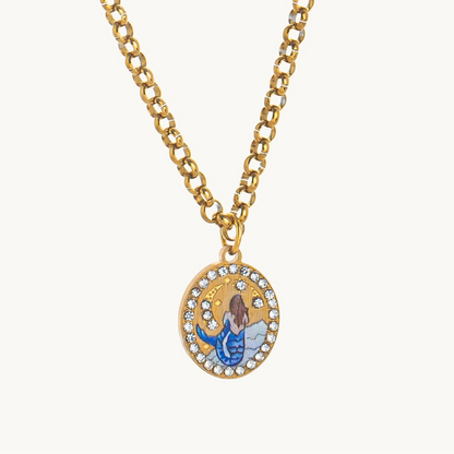 Sea Siren Necklace, an oval gold-tone pendant with an enamel mermaid under a crescent moon