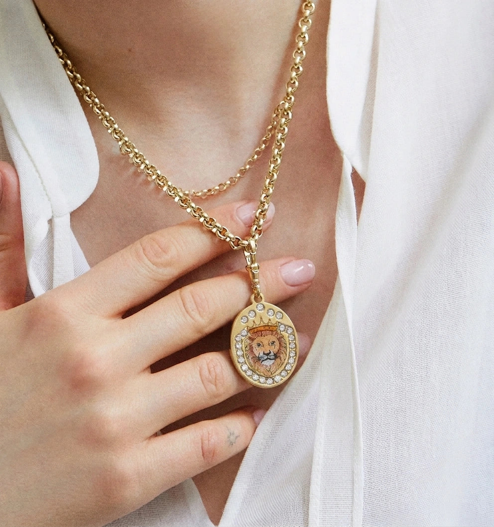 Lion Crest Necklace worn with a white shirt
