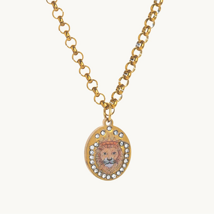 Lion Crest Necklace, an oval gold-tone pendant with a crowned enamel lion